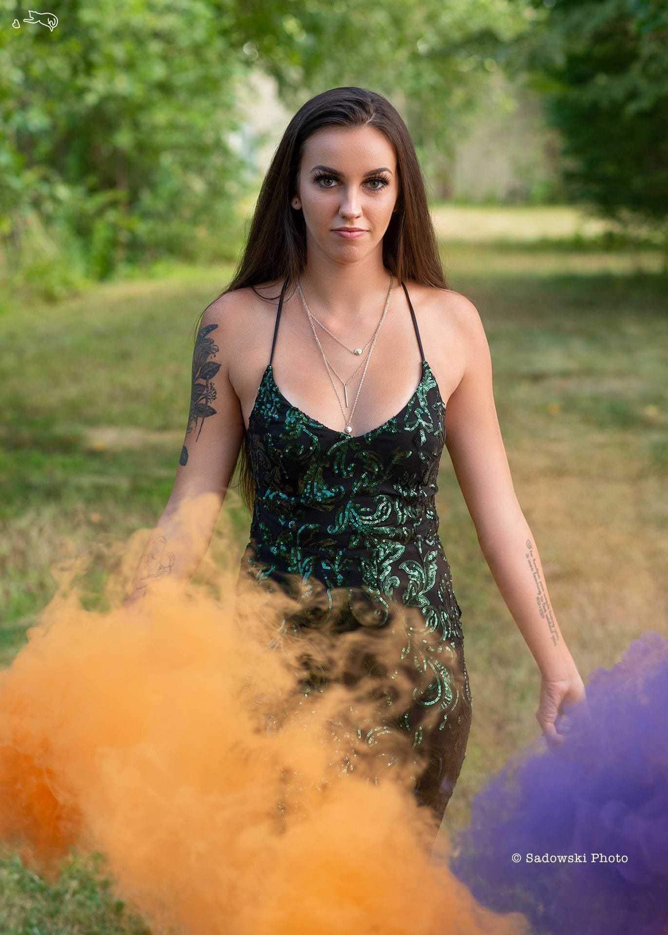 ViperGirl Haley in a green dress with purple and orange smoke bombs. Fashion, beauty and glamour.